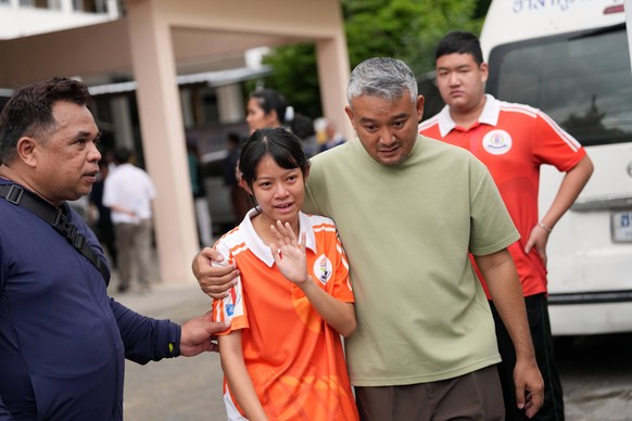 A student is guided away from the scene after a shooting at the Debsirin Nonthaburi School in Thailand's Nonthaburi province, Friday, Aug. 7, 2026. (AP Photo/Sakchai Lalit)
Thailand School Shooti ...
