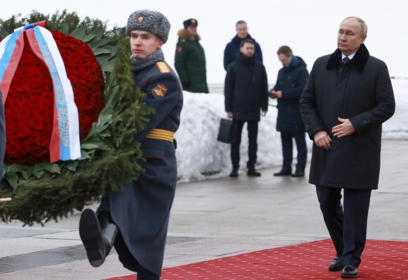 Russian President Vladimir Putin attends a wreath laying commemoration ceremony at the Piskaryovskoye Cemetery where most of the Leningrad Siege victims were buried during World War II, in St.Petersbu ...