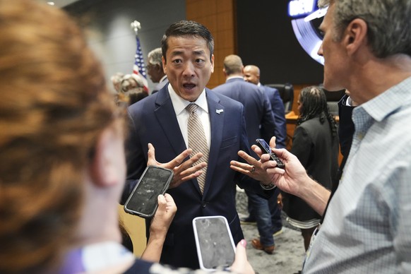 Democratic Texas Rep. Gene Wu, center, speaks with the media following a press conference with other Texas House Democrats and Democratic members of Congress at the Democratic Party in Warrenville, Il ...