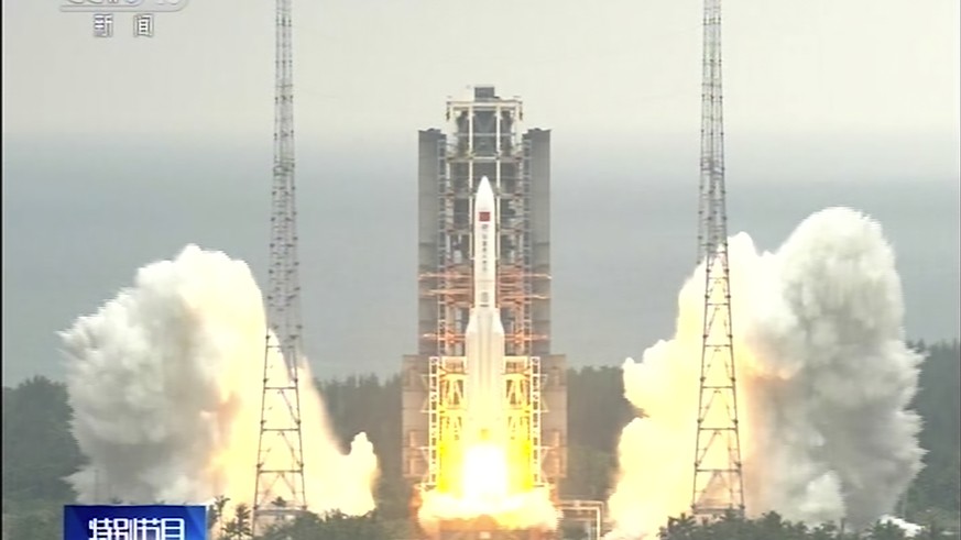 In this image taken from video footage run by China&#039;s CCTV via AP Video, a Long March 5B rocket carrying a module for a Chinese space station lifts off from the Wenchang Spacecraft Launch Site in ...