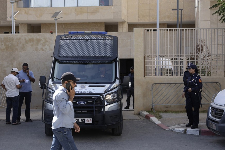 A Moroccan National Security force awaits in front of the Court of First Instance in Rabat where feminist activist Ibtissame Lachgar was brought on August 12, 2025, two days after her arrest. Moroccan ...