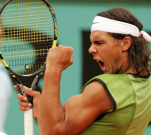 Paris 2005, le monde découvre le combo gagnant: bandana-biceps.