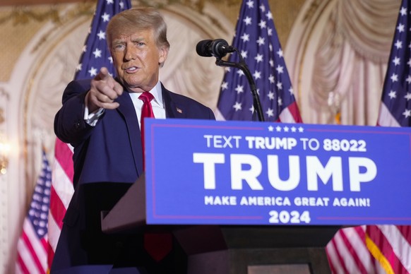 FILE - Former President Donald Trump gestures as he announces he is running for president for the third time as he speaks at Mar-a-Lago in Palm Beach, Nov. 15, 2022. Trump is facing a new legal threat ...