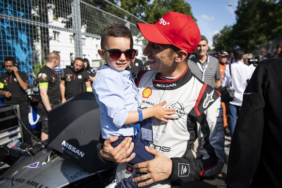 Swiss driver Sebastien Buemi, Nissan e.dams, right, and his son, Jules, pictured on the grid before the race at the Bern E-Prix, the eleventh stage of the ABB FIA Formula E championship, in Bern Switz ...