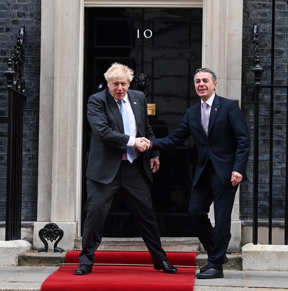 epa09913850 British Prime Minister Boris Johnson (L) ahead of a meeting with President of Switzerland Ignazio Cassis (R) at 10 Downing Street in London, Britain, 28 April 2022. EPA/ANDY RAIN