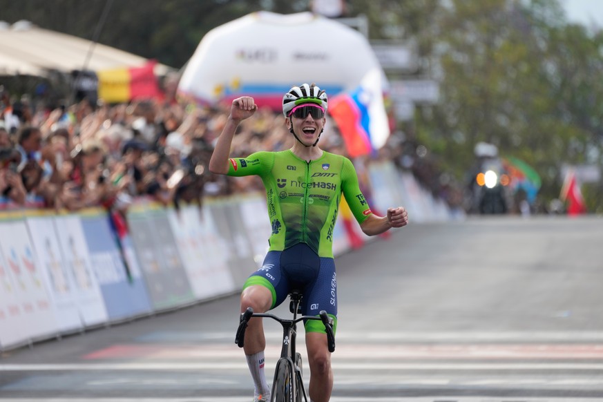 Slovenia&#039;s Tadej Pogacar celebrates winning the men&#039;s Elite road race, at the road cycling World Championships in Kigali, Rwanda, Sunday, Sept. 28, 2025. (AP Photo/Jerome Delay)
Rwanda Road  ...