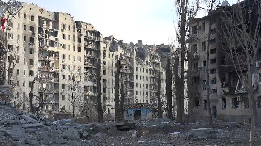This grab taken from video released by the head of the Russian-controlled Donetsk region Denis Pushilin&#039;s telegram channel on Saturday, Feb. 24, 2024, shows damaged buildings, after Russian force ...