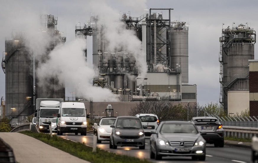 FILE - Steam rises from a chemical plant of the Evonik company in Wesseling, near Cologne, Germany, on April 6, 2022. Despite Germany&#039;s transition to renewable energy to fight climate change, the ...