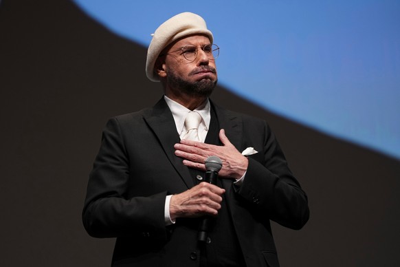 John Travolta appears before receiving the honorary Palme d'Or during the 79th international film festival, Cannes, southern France, Friday, May 15, 2026. (Photo by Scott A Garfitt/Invision/AP)
J ...