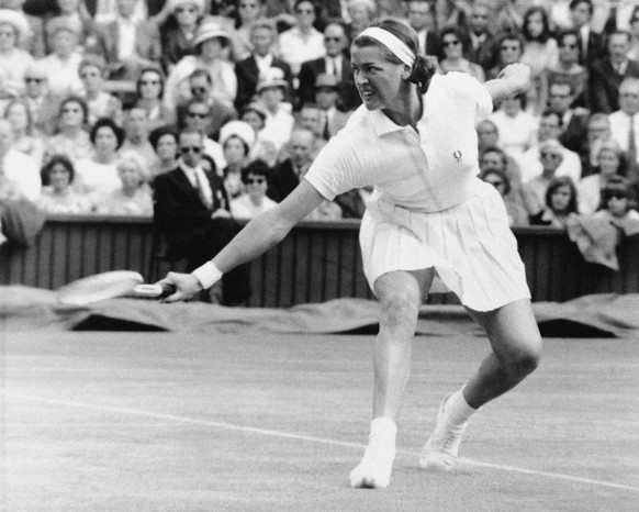 Number one seeded Margaret Smith (Court) of Australia backhands the ball back to fourth seeded Darlene Hard of Long Beach, Calif., during their Women&#039;s Singles semifinal match of the All-England  ...