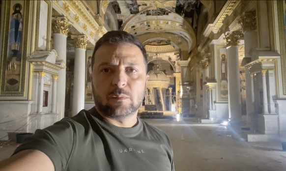 epa10772823 A handout photo made available by the Ukrainian Presidential Press Service shows Ukraine&#039;s President Volodymyr Zelensky inspecting the damage inside the Spaso-Preobrazhensky Cathedral ...