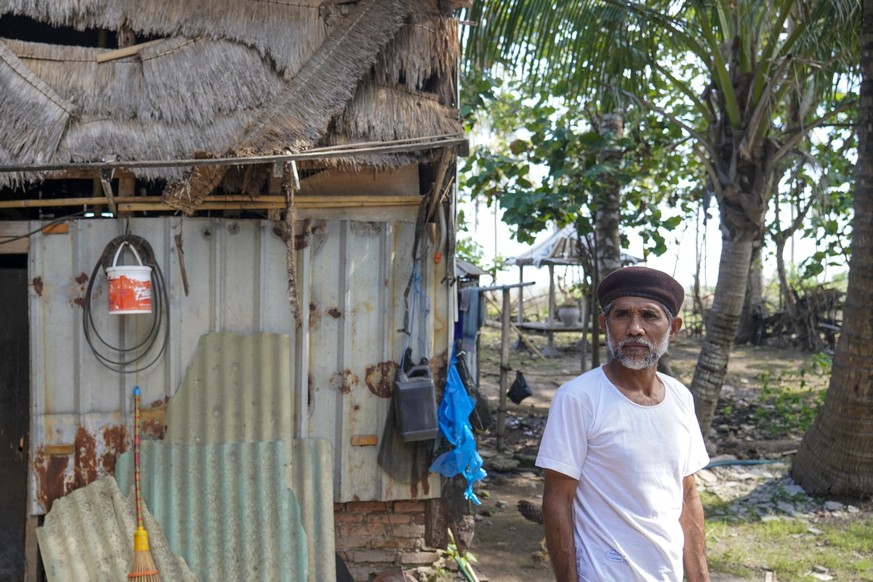 This picture taken on September 24, 2025 shows carpenter and farmer Sibawahi, who lost nearly four hectares of land across two plots for the MotoGP track and has yet to receive compensation from the g ...