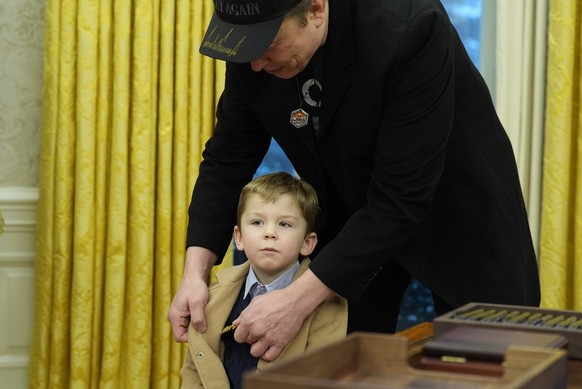 Elon Musk, joined by his son X � A-Xii, stands in the Oval Office at the White House, Tuesday, Feb. 11, 2025, in Washington, during a event with President Donald Trump. (Photo/Alex Brandon)