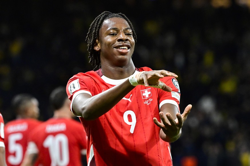 epa12445951 Switzerland's Johan Manzambi celebrates scoring the 0-2 goal during the 2026 FIFA World Cup qualifying soccer match between Sweden and Switzerland in Stockholm, Sweden, 10 October 202 ...