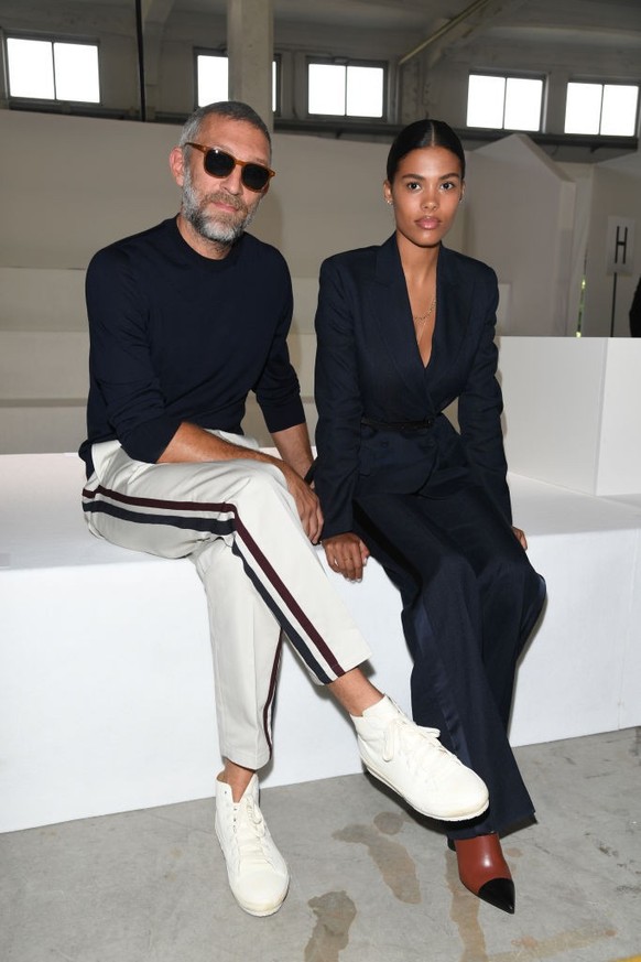 MILAN, ITALY - SEPTEMBER 22: Vincent Cassel and Tina Kunakey attend the Roberto Cavalli show during Milan Fashion Week Spring/Summer 2019 on September 22, 2018 in Milan, Italy. (Photo by Daniele Ventu ...