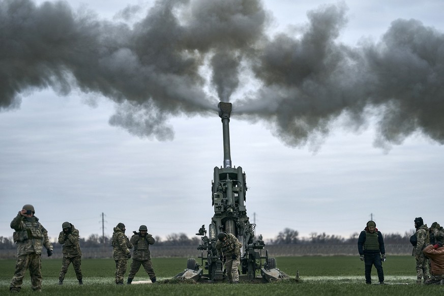 Ukrainian soldiers fire at Russian positions from a U.S.-supplied M777 howitzer in Kherson region, Ukraine, Jan. 9, 2023. A rapidly expanding group of U.S. and allied troops and contractors are using  ...