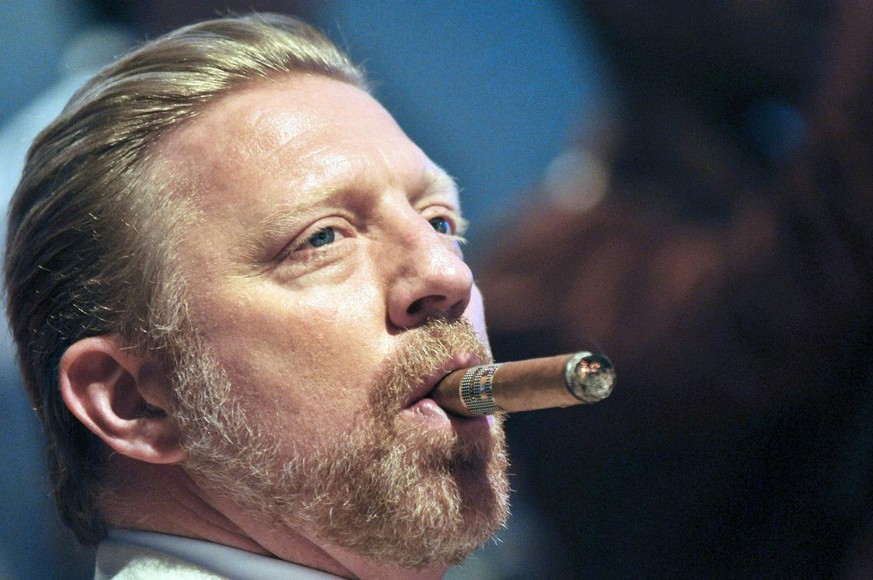 epa03607729 Former German tennis player Boris Becker smokes a cigar during the closing ceremony of the 15th Cuban Havana Cigar Festival in Havana, Cuba, late 02 March 2013. Becker arrived in Cuba on 2 ...