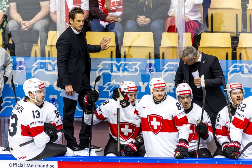 Patrick Fischer, left, head coach of Switzerland national ice hockey team, observes the game, during the IIHF 2025 World Championship preliminary round group B game between Denmark and Switzerland, at ...