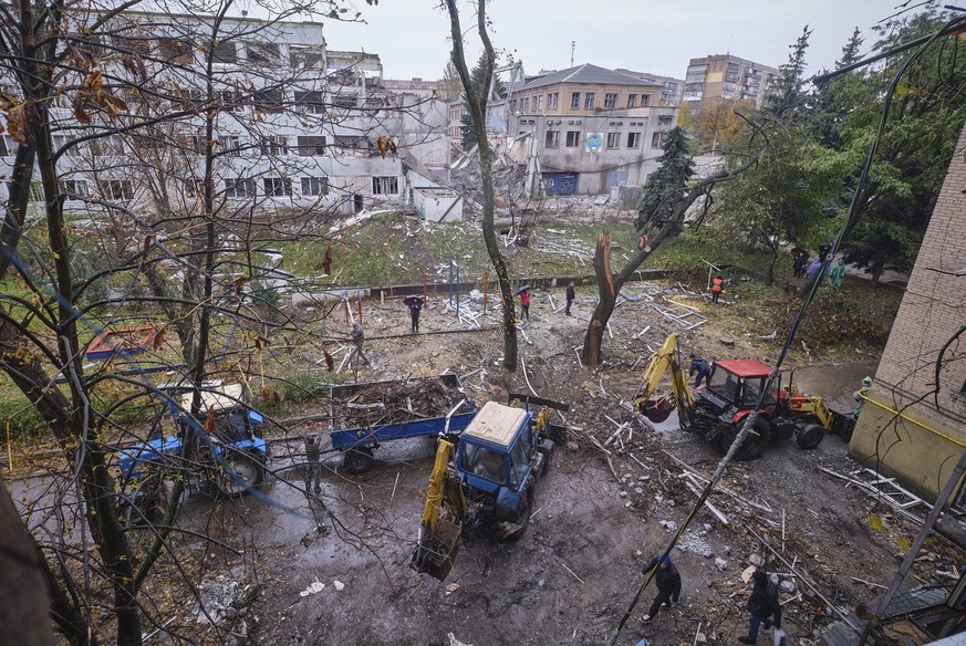 Communal workers clean debris of a residential building damaged in an overnight shelling in the small city of Druzhkivka, Donetsk area, Ukraine, 26 October 2022, amid the Russian invasion. The Ukraini ...
