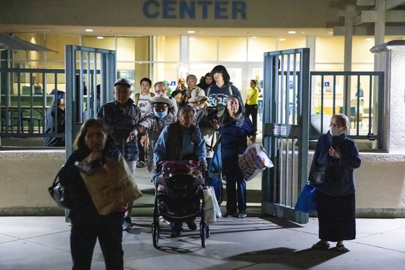 Evacuees from an aerospace chemical plant tank leak move to another shelter after the Garden Grove Sports and Recreation Center closed for the night in Garden Grove, Calif., Friday, May 22, 2026. (AP  ...