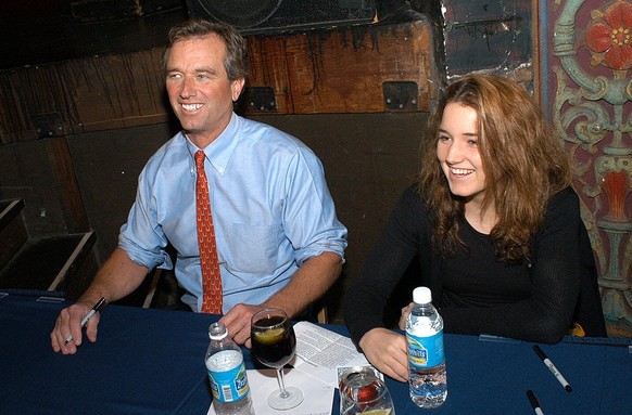 TAMPA, FL - OCTOBER 26: Robert Kennedy Jr. and his 16-year-old daughter Kick Kennedy laugh while signing his book &quot;Crimes Against Nature,&quot; an indictment of President George W. Bush&#039;s en ...