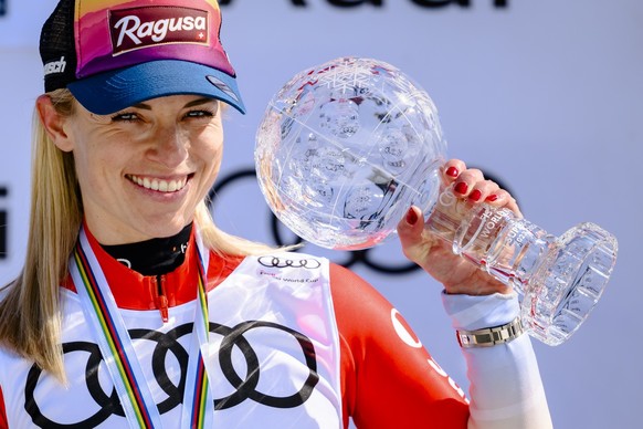 Lara Gut-Behrami of Switzerland celebrates with the women&#039;s super-g overall leader crystal globe trophy on the podium ceremony during the women&#039;s super-g race at the FIS Alpine Skiing World  ...