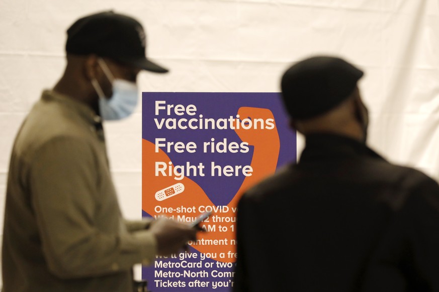 epa09194706 People queue up for the COVID-19 vaccination at Grand Central Terminal in New York, New York, USA, 12 May 2021. The pop-up site is part of a city-wide initiative to get more New Yorkers an ...