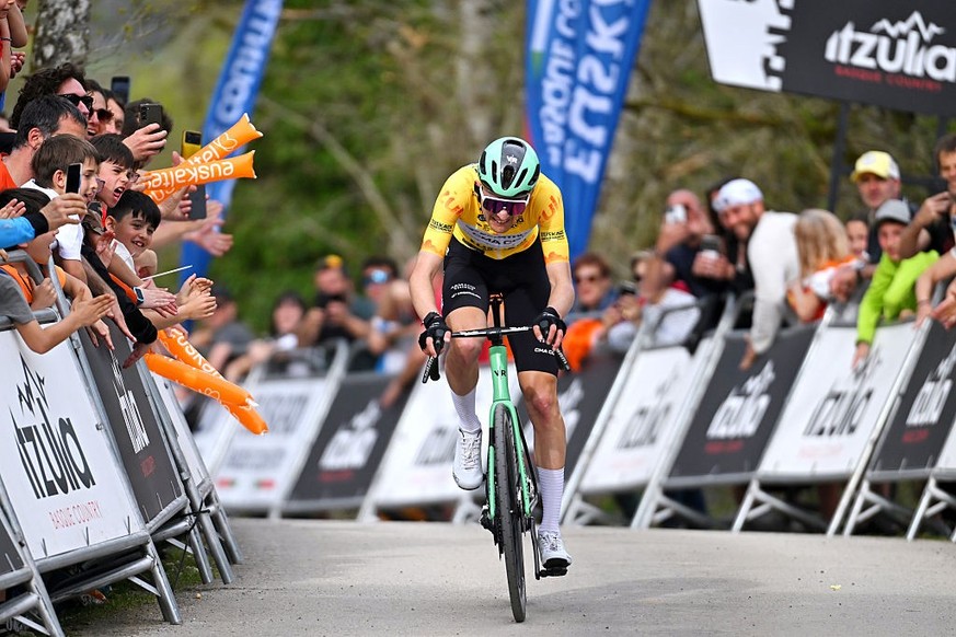 CUEVAS DE MENDUKILO, SPAIN - APRIL 07: Stage winner Paul Seixas of France and Team Decathlon CMA CGM - Yellow Leader Jersey competes in the breakaway while fans cheer during the 65th Itzulia Basque Co ...