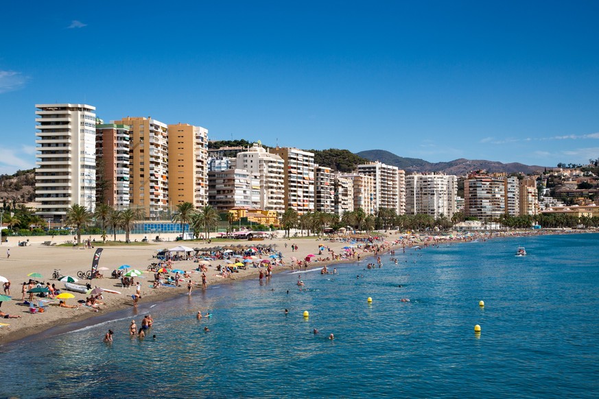 Playa de la Malagueta beach with high-rise apartment buildings, Malaga, Costa del Sol, Andalusia, Spain.