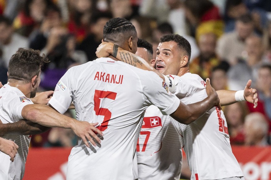 Switzerland's defender Manuel Akanji, 2nd left, celebrates with Granit Xhaka, right, after scoring to 0:1, during the UEFA Nations League group A2 soccer match between Spain and Switzerland at the Rom ...