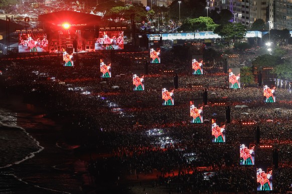epaselect epa12072308 Displays show American singer and songwriter Lady Gaga performing during a free mega concert at Copacabana beach in Rio de Janeiro, Brazil, 03 May 2025. EPA/ANDRE COELHO