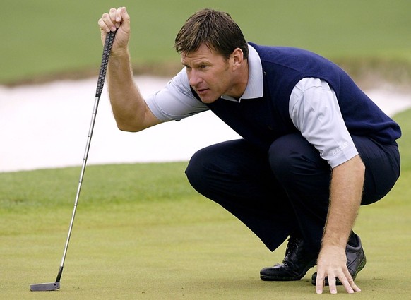 AGS04 - 20020411 - AUGUSTA, GA, UNITED STATES : Nick Faldo of England lines up his putt on the second hole during the opening round for the 2002 Masters Tournament at the Augusta National Golf Club in ...