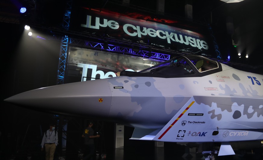 epa09586637 The prototype of its fifth generation military aircraft, a Su-75 dry checkmate which is unveiled and displayed at Russian Pavilion, during the exhibition of the Dubai Airshow 2021 at the D ...