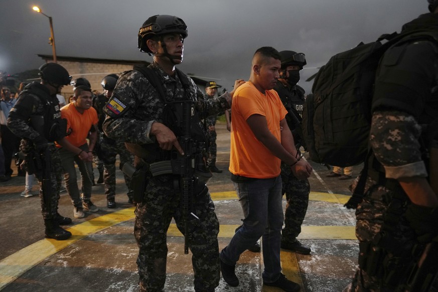 Gang leaders who are operating inside the Bellavista jail are transferred to other jails after a deadly riot broke out overnight in Santo Domingo de los Tsachilas, Ecuador, Monday, May 9, 2022. (AP Ph ...
