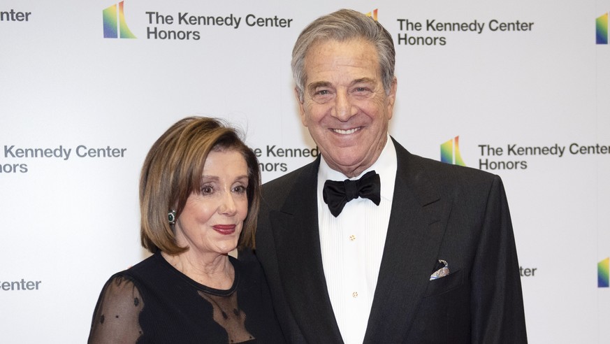 FILE - Speaker of the House Nancy Pelosi, D-Calif., and her husband, Paul Pelosi, arrive at the State Department for the Kennedy Center Honors State Department Dinner, on Dec. 7, 2019, in Washington.  ...