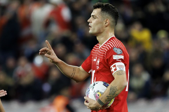 Switzerland&#039;s midfielder Granit Xhaka reacts, during the UEFA Euro 2024 qualifying group I soccer match between Switzerland and Israel, at the Stade de Geneve, in Geneva, Switzerland, Tuesday, Ma ...