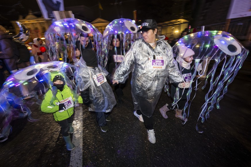 epa11763203 Dressed up participants run at the &#039;Course de la Marmite&#039; during the 46th Escalade Race (Course de l&#039;Escalade) in Geneva, Switzerland, 07 December 2024. The sporting athleti ...