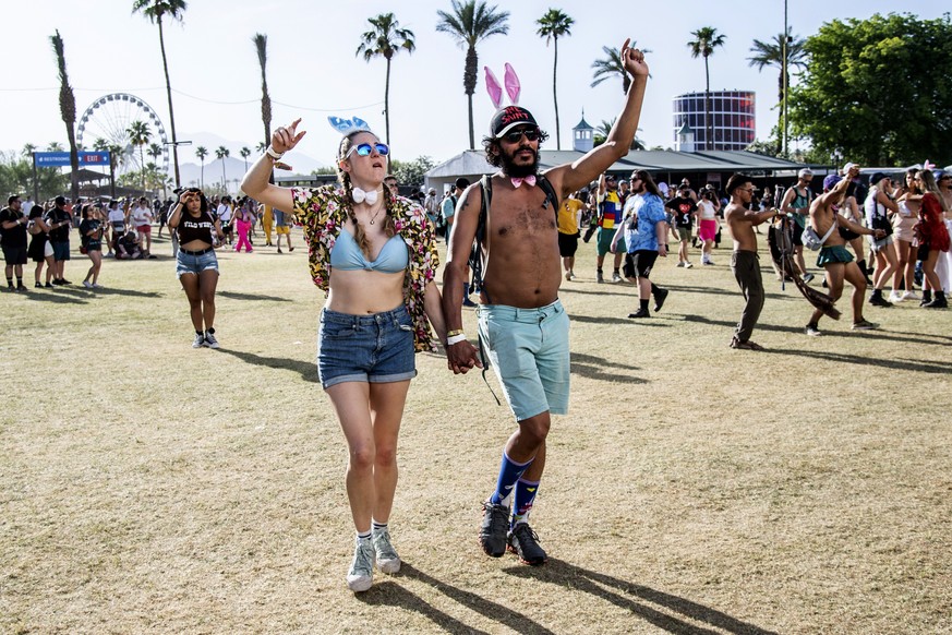 Festivalgoers attend the Coachella Music &amp; Arts Festival at the Empire Polo Club on Sunday, April 17, 2022, in Indio, Calif. (Photo by Amy Harris/Invision/AP)