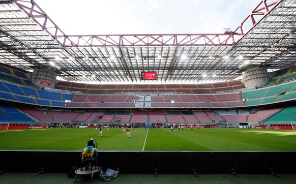 FILE - A view of the empty stadium during the Serie A soccer match between AC Milan and Genoa at the San Siro stadium, in Milan, Italy, Sunday, March 8, 2020. (AP Photo/Antonio Calanni, File)
Milan Ne ...