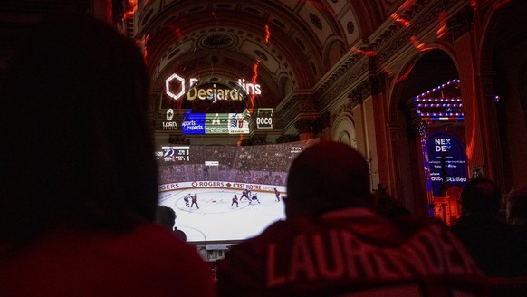 Montreal Canadiens fans watch the live broadcasting of the Stanley Cup playoff game against Tampa Bay Lightning inside the Cathedrale Saint-Jean-lEvangeliste, in Saint-Jean-sur-Richelieu, Quebec, on  ...