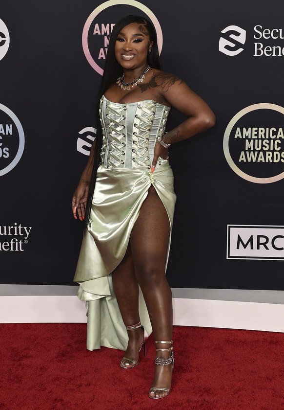 Erica Banks arrives at the American Music Awards on Sunday, Nov. 21, 2021, at Microsoft Theater in Los Angeles. (Photo by Jordan Strauss/Invision/AP)