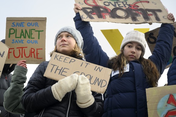 Sweden&#039;s climate activist Greta Thunberg, left, and other young climate activists of the &quot;Friday for Future Climate Strike&quot; movement stage an unauthorised demonstration on the sideline  ...