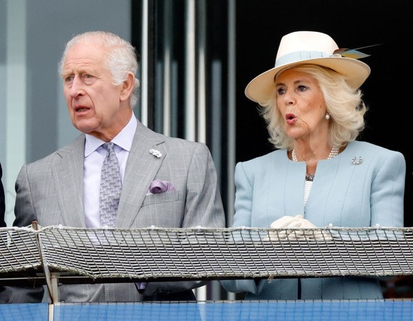 EPSOM, UNITED KINGDOM - MAY 31: (EMBARGOED FOR PUBLICATION IN UK NEWSPAPERS UNTIL 24 HOURS AFTER CREATE DATE AND TIME) King Charles III and Queen Camilla watch the racing as they attend &#039;Ladies D ...