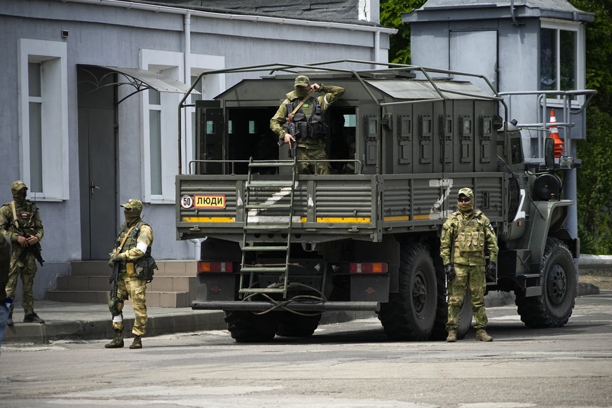 FILE - Russian soldiers guard an area as a group of foreign journalists visit in Kherson, Kherson region, south Ukraine, May 20, 2022. The southern city of Kherson was the first to fall to Russia&#039 ...