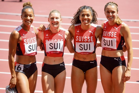 From left, Salome Kora, Ajla Del Ponte, Mujinga Kambundji, and Riccarda Dietsche of Switzerland react after the finish line of the women&#039;s athletics 4x100m relay heat at the 2020 Tokyo Summer Oly ...