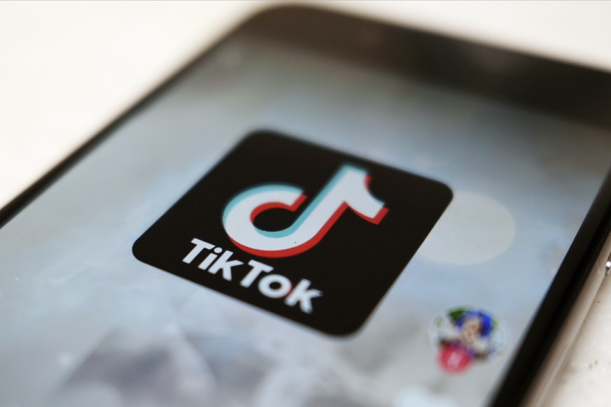 FILE - This Monday, Sept. 28, 2020, file photo, shows the TikTok logo on a smartphone in Tokyo. On Sunday, March 6, 2022, Netflix and TikTok suspended most of their services in Russia as the governmen ...