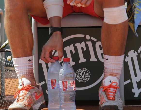 Spain&#039;s Rafael Nadal meticulously places his water bottles besides his chair in his semifinal match against Serbia&#039;s Novak Djokovic at the French Open tennis tournament, at Roland Garros sta ...