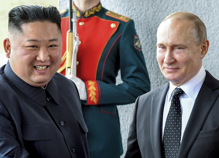 FILE - Russian President Vladimir Putin, center right, and North Korea&#039;s leader Kim Jong Un shake hands during their meeting in Vladivostok, Russia on April 25, 2019. As North Korea conducts more ...