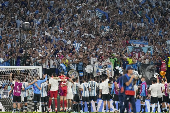 Players of Argentina face fans after beating Australia 2-1 in a World Cup round of 16 soccer match at the Ahmad Bin Ali Stadium in Doha, Qatar, Saturday, Dec. 3, 2022. (AP Photo/Thanassis Stavrakis)