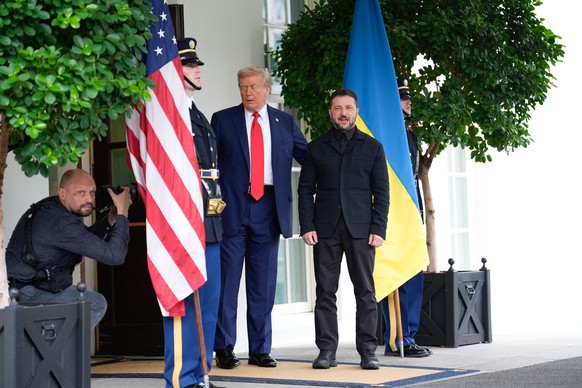 epa12308438 US President Donald Trump (L) greets Ukrainian President Volodymyr Zelensky (R) before their meeting with European Leaders at the White House in Washington, DC, USA, 18 August 2025. US Pre ...